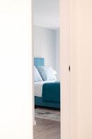 Postel nebo postele na pokoji v ubytování Orange Boutique Residence - Casa Luis Camões