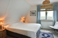 Postel nebo postele na pokoji v ubytování Beachhouse Zonneweelde