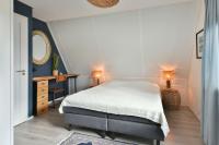 Postel nebo postele na pokoji v ubytování Beachhouse Zonneweelde