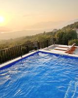 a swimming pool on a balcony with a view at Apartments HAS in Kotor