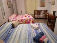 Posteľ alebo postele v izbe v ubytovaní Casa vacanze su sorighe.