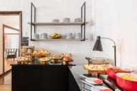 a kitchen with a counter with food on it at DELPLAZA Timbiras São Paulo in São Paulo