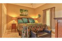 ein Schlafzimmer mit einem Bett und einem Stuhl in der Unterkunft Beach Resort 507 - Great Views Beautiful Decor Zero Entry Pool in Destin