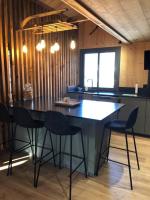 a kitchen with a table and chairs in a room at Chalet au pied des pistes du Cambre d Aze in Saint-Pierre-dels-Forcats