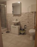 a bathroom with a sink and a toilet at Apartment Nadalina in Kraljevica