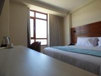 Ein Bett oder Betten in einem Zimmer der Unterkunft Muña Hotel Andahuaylas