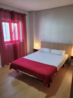 Postel nebo postele na pokoji v ubytování Fernandes Apartments