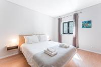 Postel nebo postele na pokoji v ubytování Fernandes Apartments