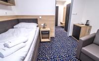 Postel nebo postele na pokoji v ubytování Rehabilitační sanatorium - Lázně Darkov