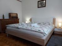 Posteľ alebo postele v izbe v ubytovaní Apartman Tinče
