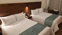 Ein Bett oder Betten in einem Zimmer der Unterkunft Muña Hotel Andahuaylas