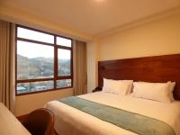 Ein Bett oder Betten in einem Zimmer der Unterkunft Muña Hotel Andahuaylas