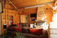 a living room with a couch and a fireplace at CHALET ELISTHUR in Saint-Jean-d&#39;Aulps