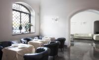 a dining room with tables and chairs and a window at Palazzo Brunaccini Boutique Hotel in Palermo