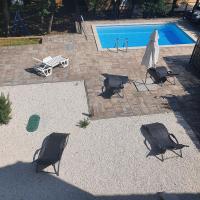 an overhead view of a swimming pool with chairs and a umbrella at Dee&#39;s House and Pool in Labin