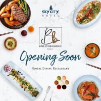 uma mesa branca com pratos de comida em Sky City Hotel Dhaka em Dhaka