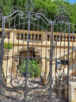 a metal gate with a fountain behind it at Mont Boron Exclusive Apartment in Villa Belle Époque in Nice