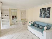a living room with a blue couch and a glass table at Mont Boron Exclusive Apartment in Villa Belle Époque in Nice