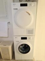 a washer and dryer in a room with a washing machine at Mont Boron Exclusive Apartment in Villa Belle Époque in Nice