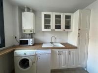 Kuchyň nebo kuchyňský kout v ubytování Apartamento Moderno