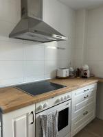 Kuchyň nebo kuchyňský kout v ubytování Apartamento Moderno