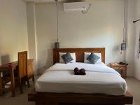 Kuta Circle Homestayにあるベッド