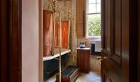 a bathroom with a tub and a shower in it at The Rookery in London