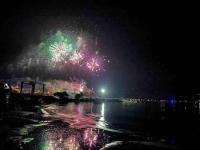 a firework display in the sky over a body of water at Exceptionnelle Vue Mer Calvi - Piscine - T2 in Calvi