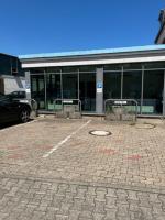 a parking lot in front of a building at Airport Lounge Hotel Düsseldorf in Düsseldorf