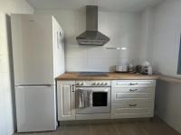 Kuchyň nebo kuchyňský kout v ubytování Apartamento Moderno