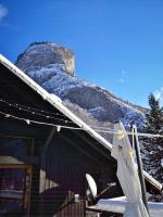 a building with a snow covered mountain in the background at CHALET ELISTHUR in Saint-Jean-d&#39;Aulps