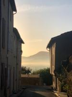 an alley way with a view of a mountain at Maison Marie in Lagarde