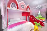 a childs bedroom with a red and white bunk bed at Fairy Story Village Farm B&amp;B in Dongshan