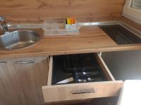 a kitchen counter with a sink and a sink at Kineski zid in Zenica