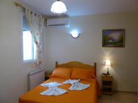 A bed or beds in a room at Hostal Huespedes Toledo