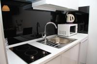 Kuchyň nebo kuchyňský kout v ubytování Studio Apartments Mirakul