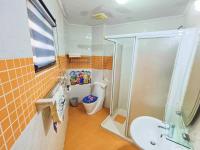 a bathroom with a shower and a sink and a toilet at 恆春古城親子民宿 in Hengchun South Gate