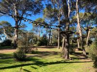 a park with trees and grass with a fence at CAP D&#39;AGDE studio cabine 6 pers. + terrasse + parking privé + clim (calme) in Cap d&#39;Agde