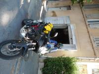 a man is sitting on a motorcycle in a garage at Villa Zola in Aix-en-Provence