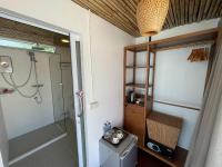 a bathroom with a shower and a glass shower stall at Nice Sea Resort in Srithanu