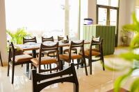 a dining room with a table and chairs at Destination Beach Hotel by Dreamworld in Karachi