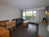 Część wypoczynkowa w obiekcie Appartement lumineux proche pistes, commerces, balcon - FR-1-502-408