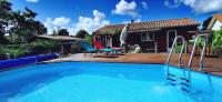 a swimming pool in front of a house at MAISON &amp; PISCINE PRIVES,PLAGES OCEAN ET LAC A 10 kms in Linxe
