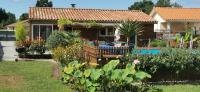 a house with a garden in front of it at MAISON &amp; PISCINE PRIVES,PLAGES OCEAN ET LAC A 10 kms in Linxe