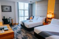 The Waterfront Hotel Kuchingにあるベッド