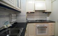 Kuchyň nebo kuchyňský kout v ubytování GRECIA 2 D - apartamento