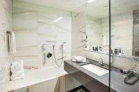 a bathroom with a sink and a mirror at Austria Trend Hotel Congress Innsbruck in Innsbruck