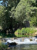 a waterfall in the middle of a river at Apartment Angelina 