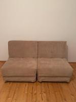 a brown couch sitting on top of a wooden floor at Apartment Angelina 