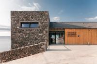 a stone building with a window on the side of it at Lava Homes in Santo Amaro